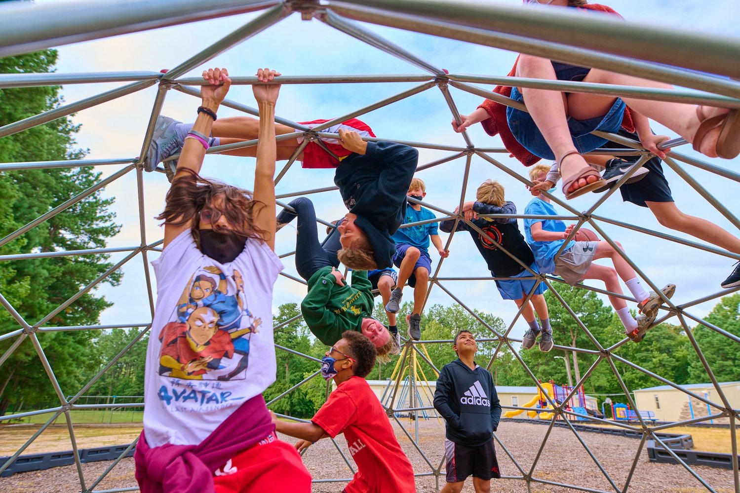 The dual language camp was designed to teach students
Spanish while also having fun. Here, middle school students
at North Chatham spend time on the playground.